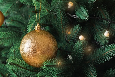 Photo of Beautiful Christmas tree with festive decor as background, closeup