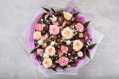 Beautiful food bouquet on light grey table, top view