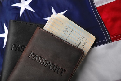 Photo of Passports and tickets on flag of USA