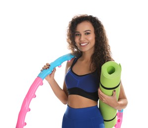 Photo of Beautiful African American woman with yoga mat and hula hoop on white background