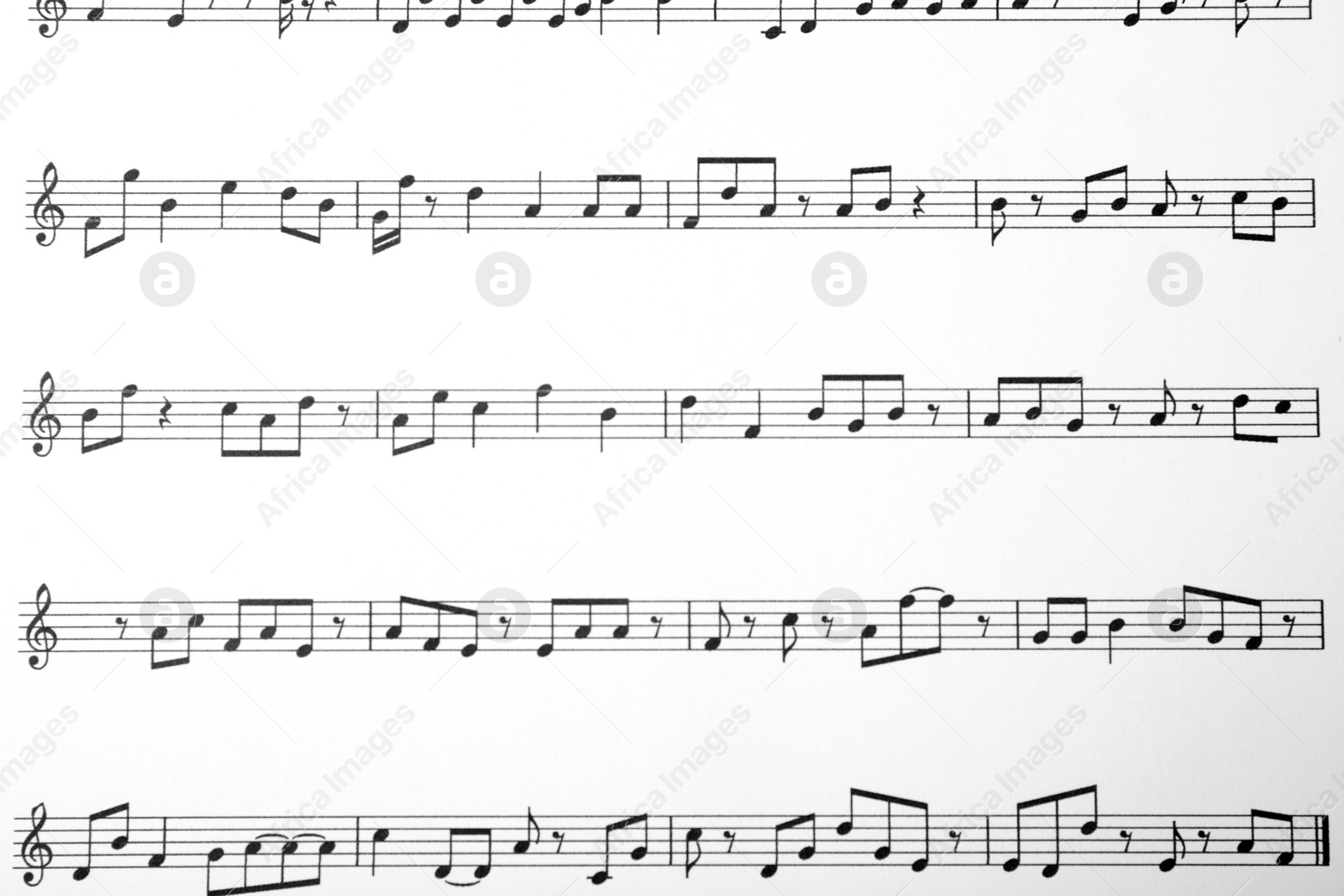 Photo of Sheet with music notes as background, top view