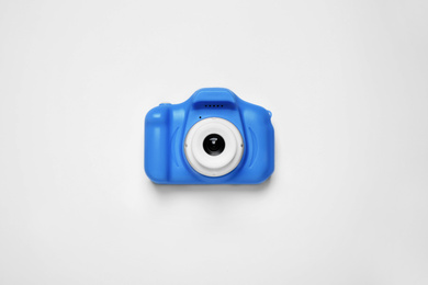 Photo of Toy camera isolated on white, top view. Classic blue - color of the Year 2020