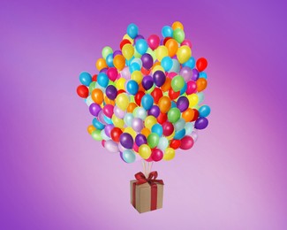 Image of Many balloons tied to gift box on purple background