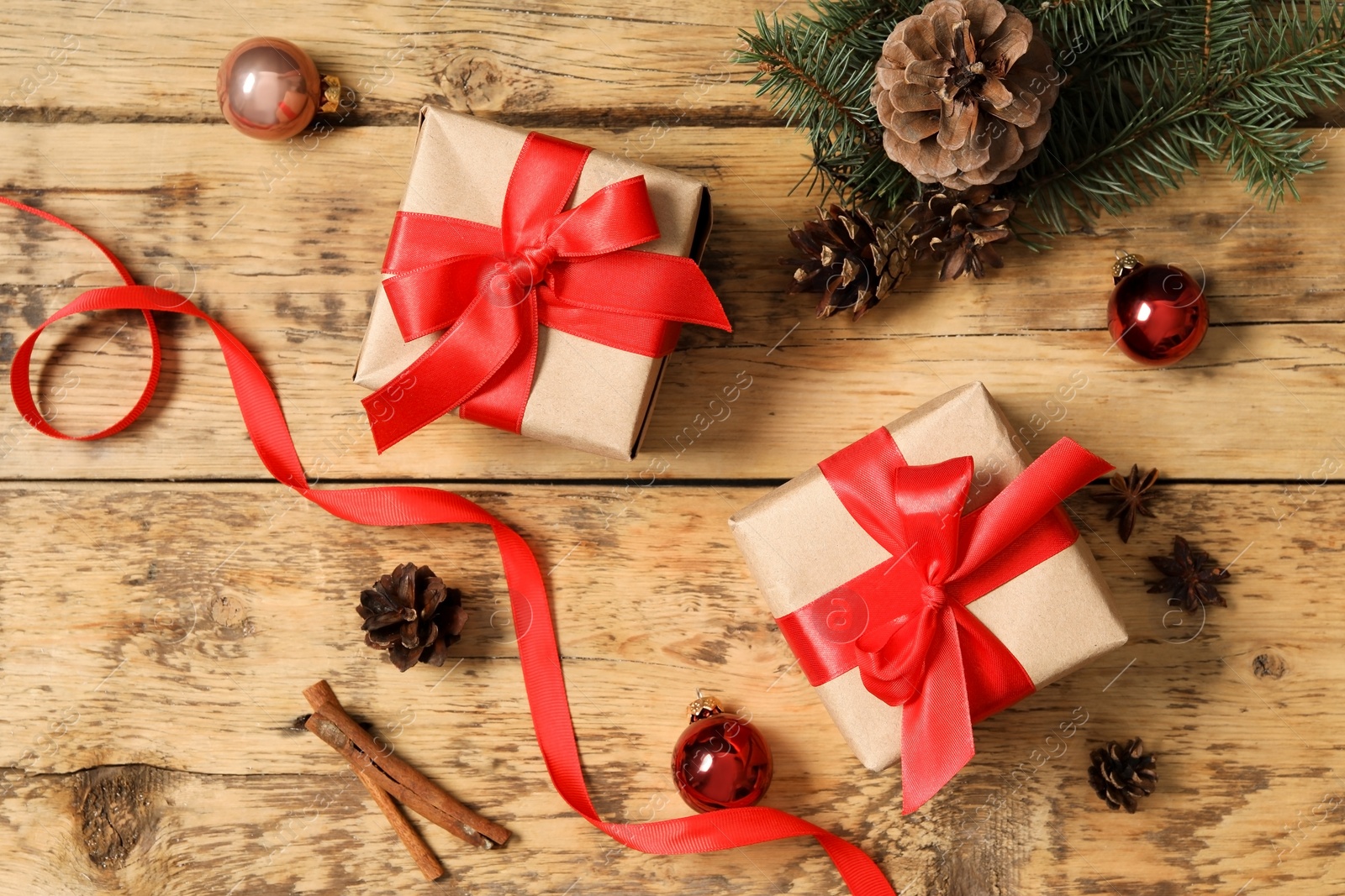 Photo of Flat lay composition with Christmas gift boxes on wooden table