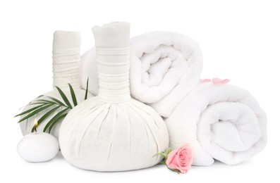 Photo of Herbal massage bags and towels on white background. Spa supply