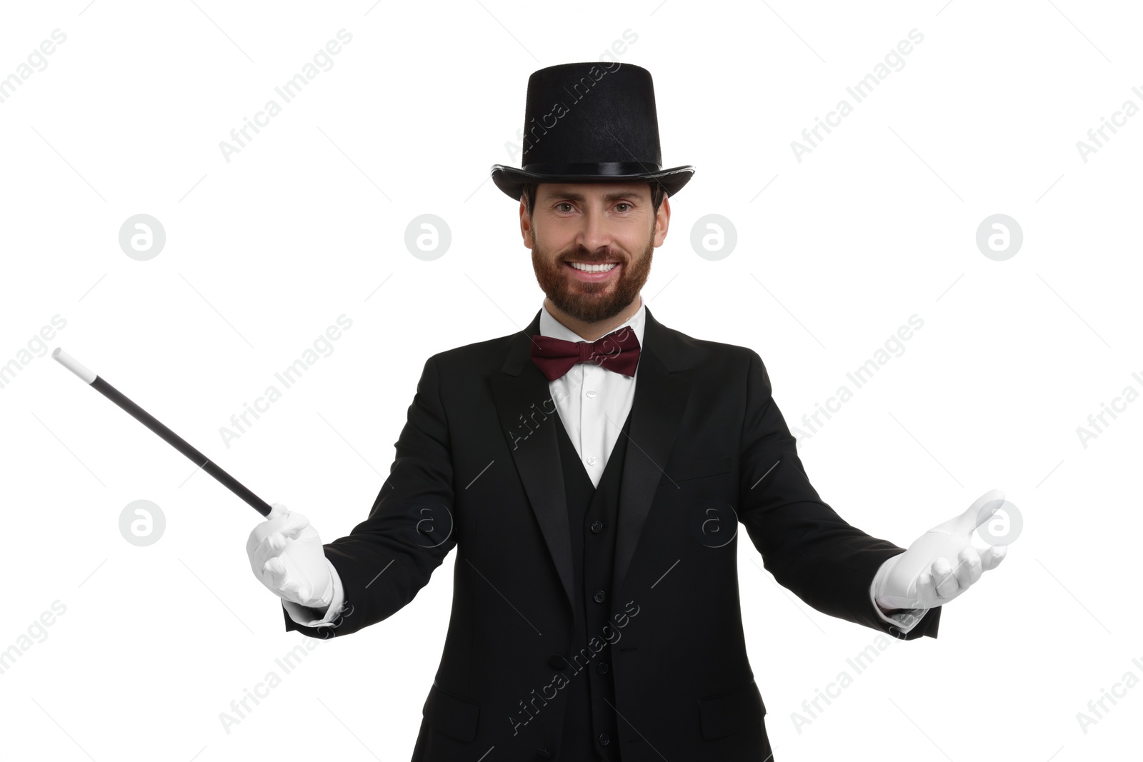 Photo of Happy magician in top hat holding wand on white background