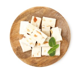 Photo of Pieces of delicious nougat and mint isolated on white, top view