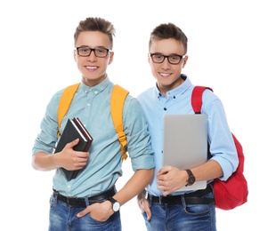 Photo of Teenage twin brothers with glasses on white background