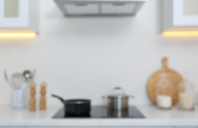 Blurred view of modern kitchen with stove