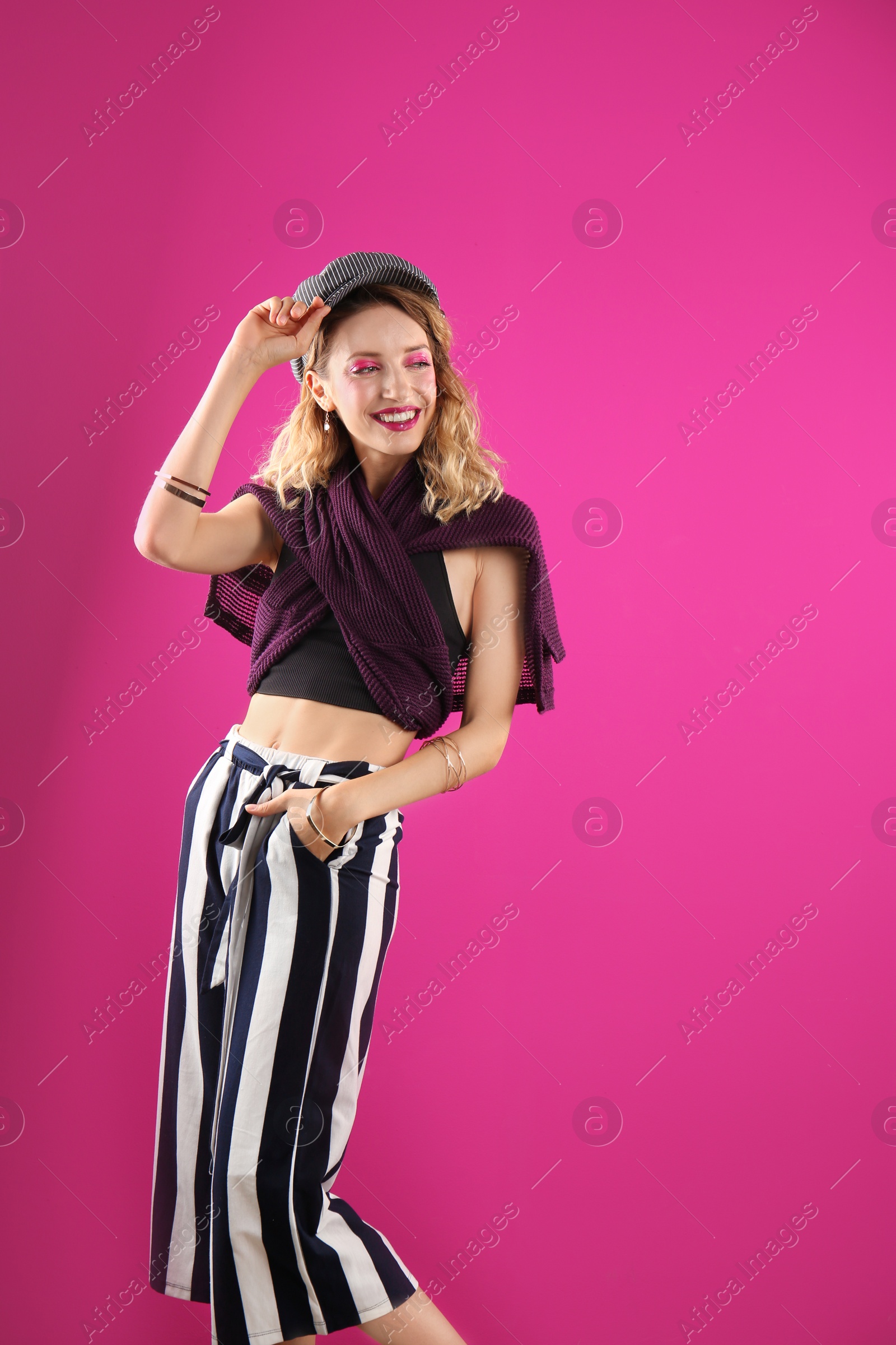 Photo of Beautiful young woman posing on color background. Summer fashion