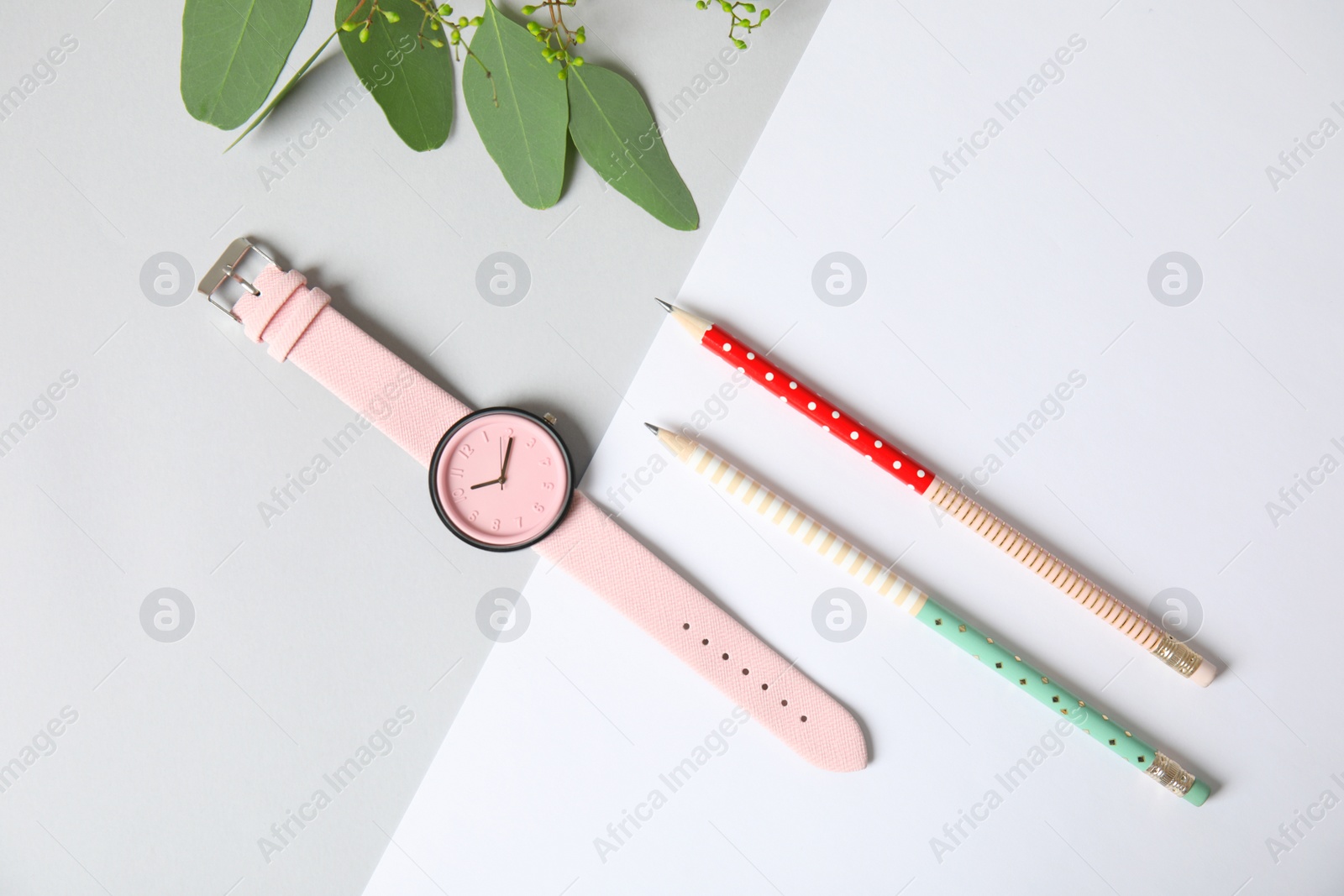 Photo of Flat lay composition with stylish wrist watch on table. Fashion accessory