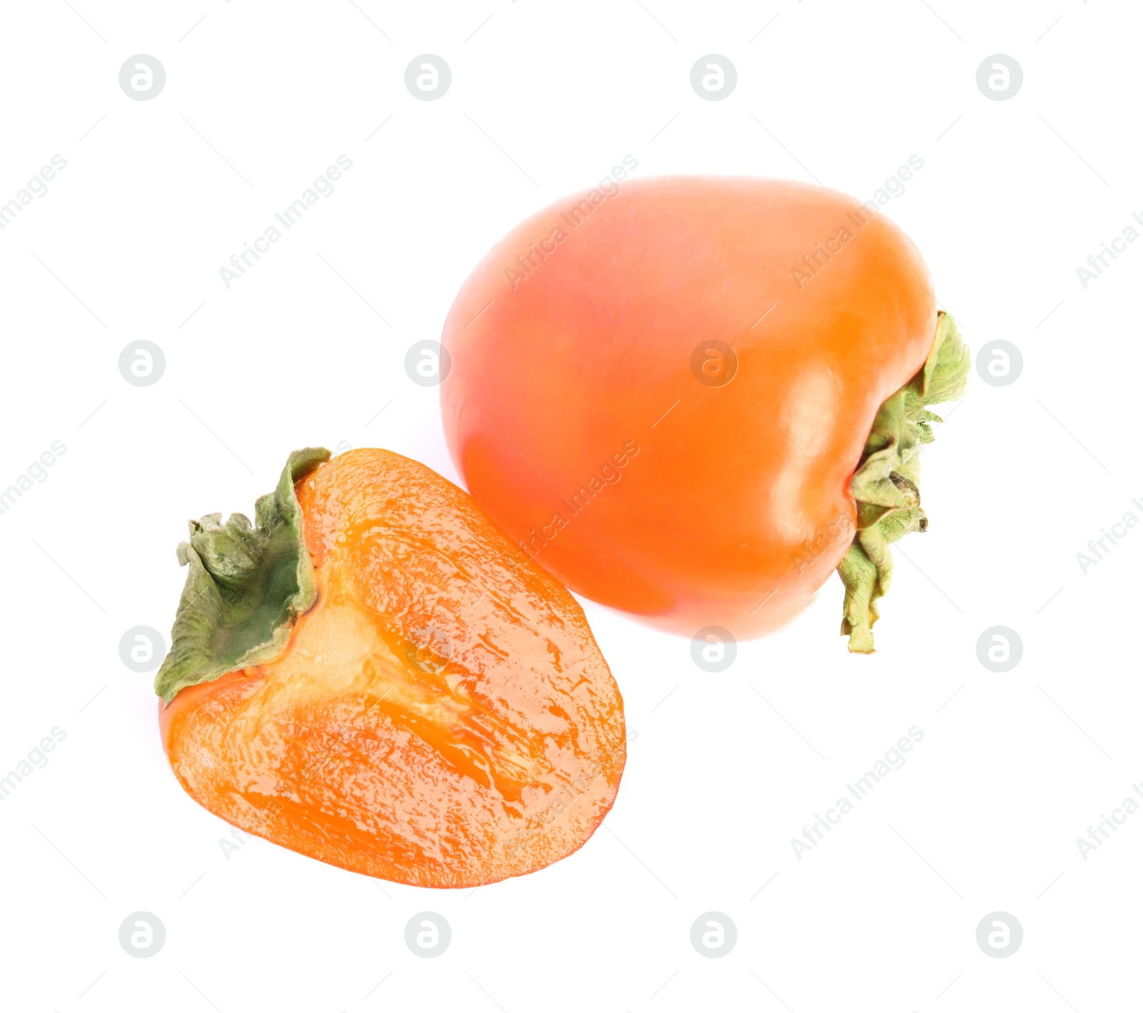 Photo of Delicious cut and whole fresh persimmons isolated on white, top view