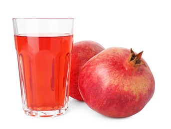 Photo of Refreshing pomegranate juice in glass and fruits isolated on white