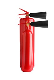 Photo of Two red fire extinguishers on white background