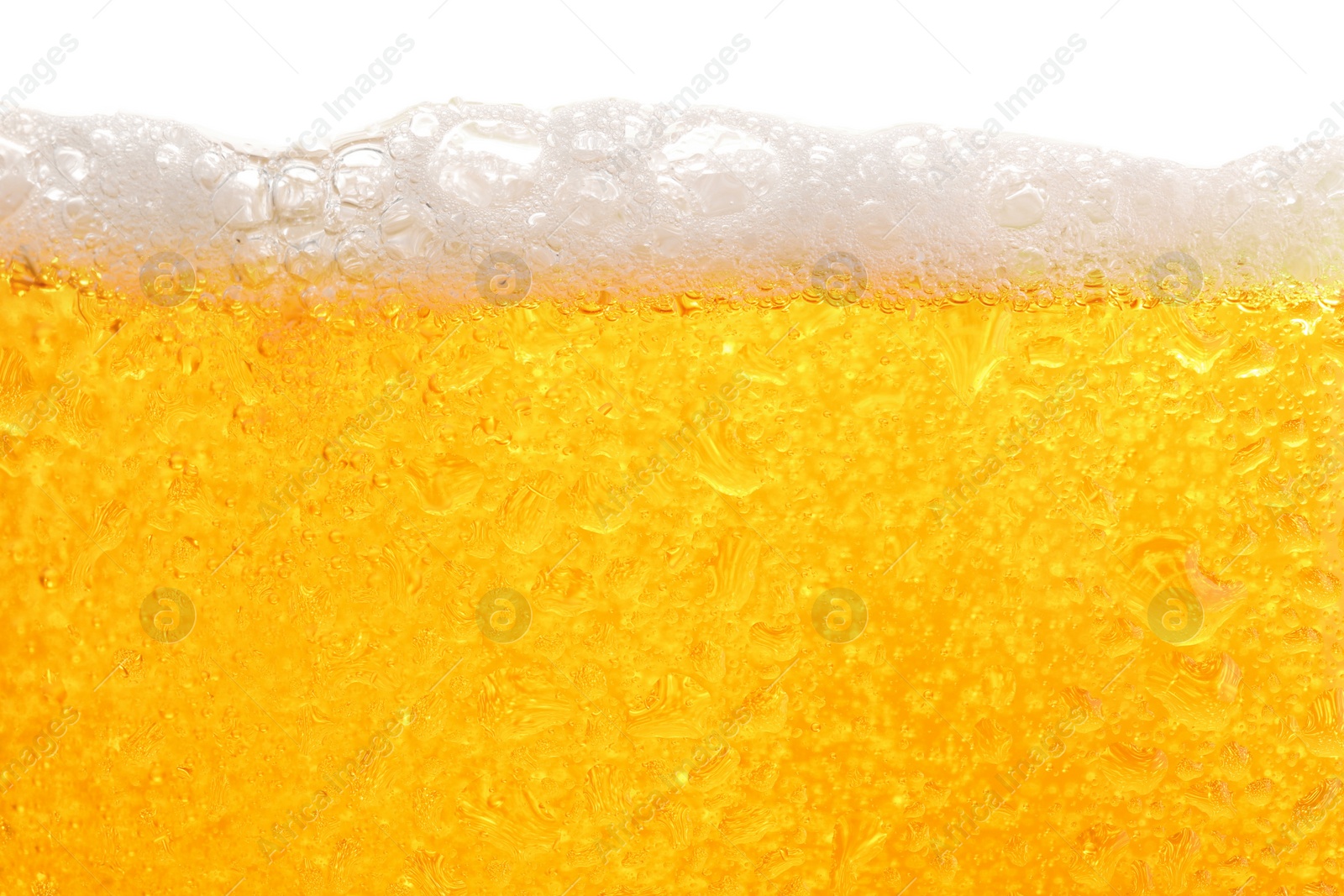 Photo of Glass of tasty cold beer with foam and condensation drops on white background, closeup