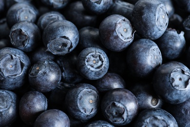 Fresh raw blueberries as background, closeup view