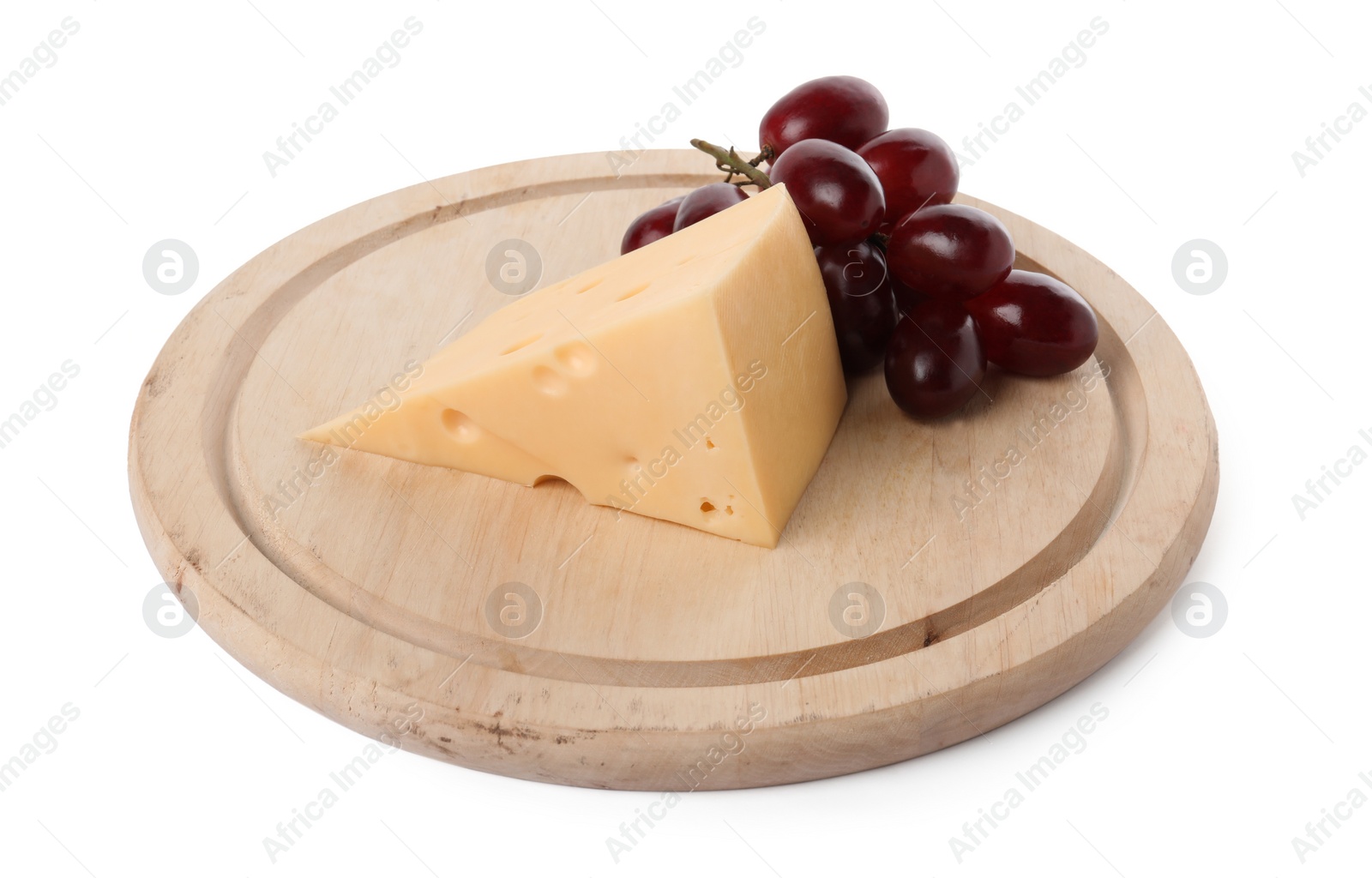 Photo of Piece of delicious cheese and grapes isolated on white