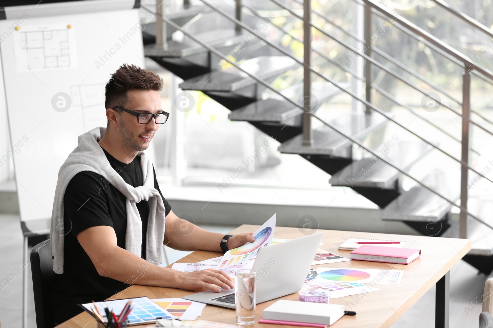 Photo of Professional interior designer at workplace in office