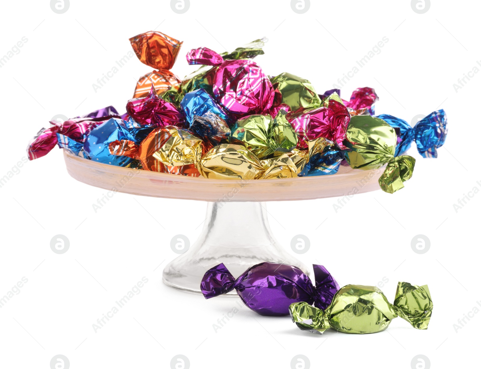 Photo of Stand with candies in colorful wrappers isolated on white