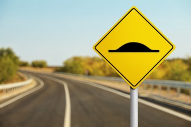 Sign Speed Bump near asphalt road outdoors 