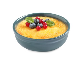 Photo of Delicious creme brulee with fresh berries isolated on white