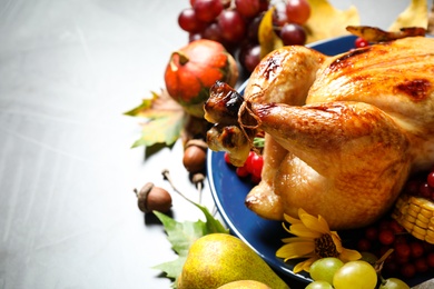 Photo of Closeup of delicious turkey on grey background, space for text. Happy Thanksgiving day