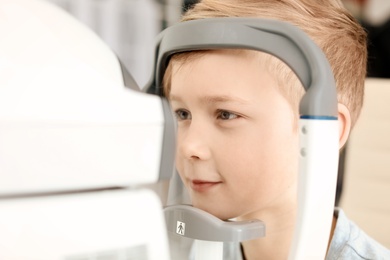 Little boy visiting ophthalmologist in clinic