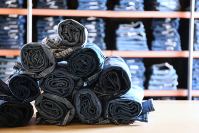 Rolled modern jeans on display in shop