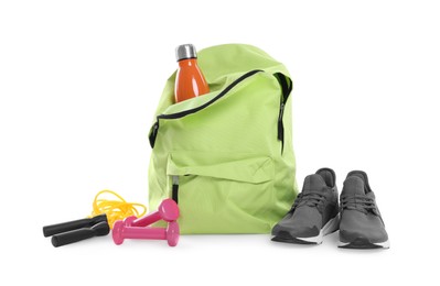 Photo of Backpack with sports equipment on white background