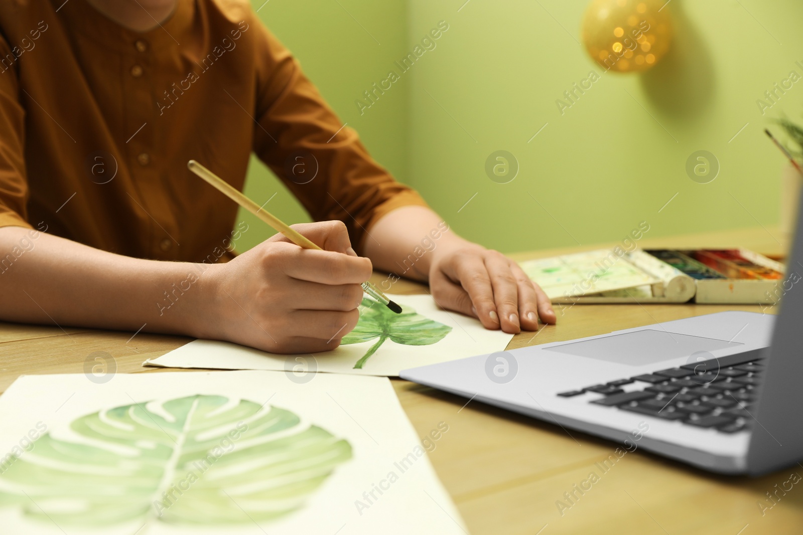 Photo of Woman drawing picture at online art lesson, closeup. Distant learning