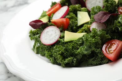 Delicious salad with kale leaves on table, closeup