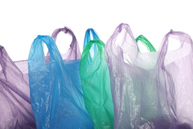 Photo of Many different plastic bags on white background
