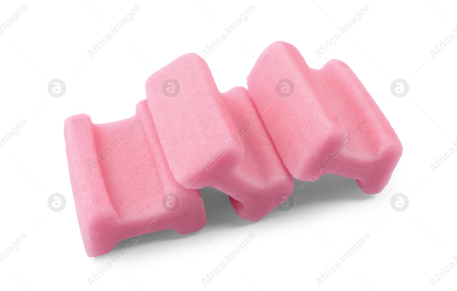 Photo of Tasty pink chewing gums on white background