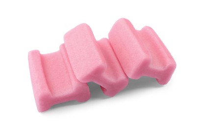 Photo of Tasty pink chewing gums on white background