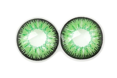 Two green contact lenses isolated on white, top view