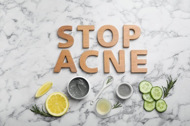 Phrase "Stop acne" and homemade effective problem skin remedies on light background, flat lay