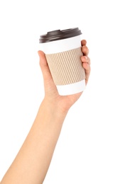 Photo of Woman holding takeaway paper coffee cup with cardboard sleeve on white background, closeup