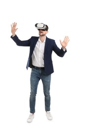 Photo of Man using virtual reality headset on white background
