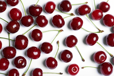 Photo of Sweet juicy cherries on white background, top view