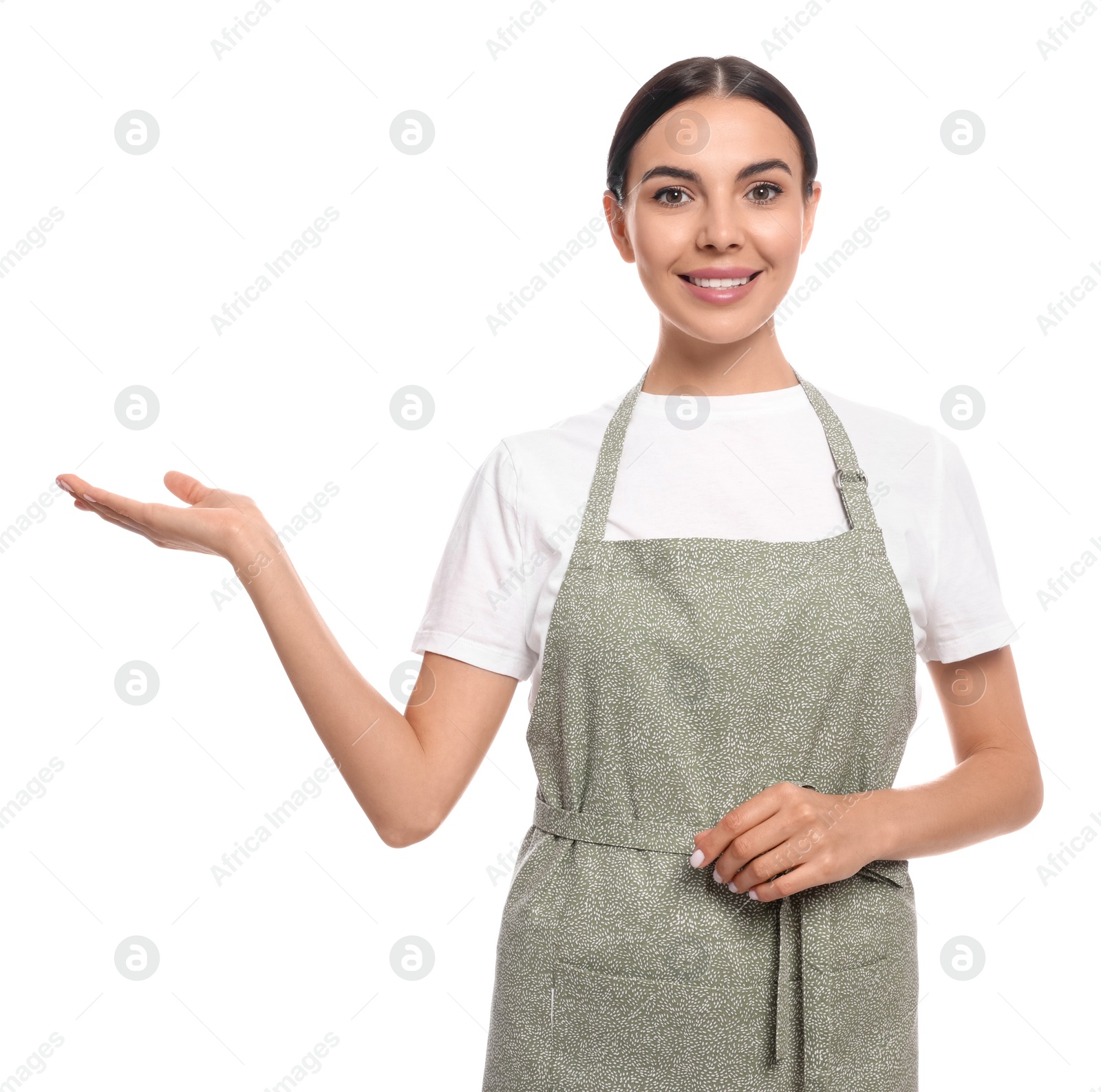 Photo of Young woman in light green apron on white background