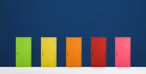 Image of Many colorful doors in room. Concept of choice 