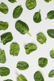 Fresh leaves of spinach isolated on white, top view