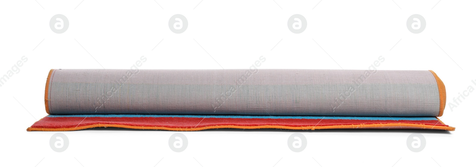 Photo of Rolled colorful carpet on white background. Interior element