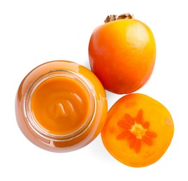 Photo of Delicious persimmon jam and fresh fruits isolated on white, top view