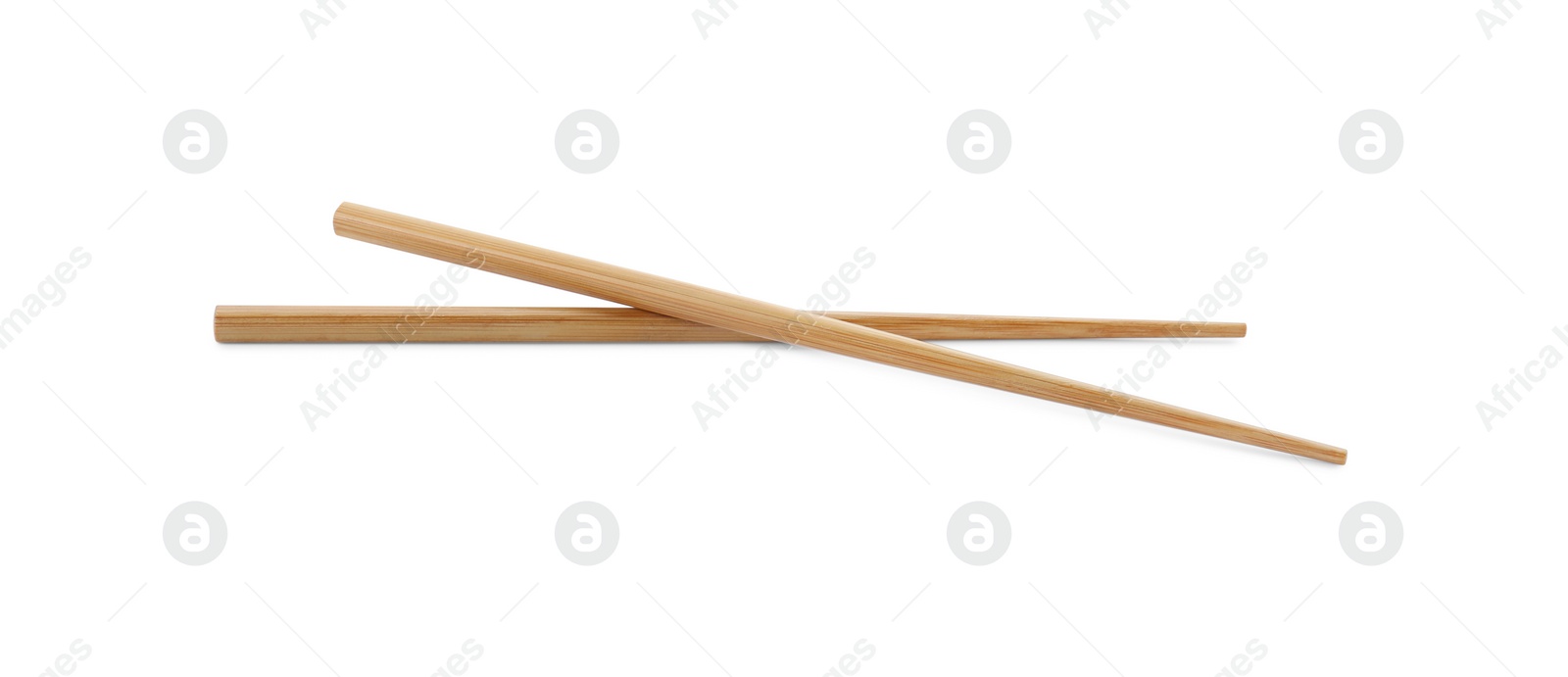 Photo of Pair of wooden chopsticks isolated on white