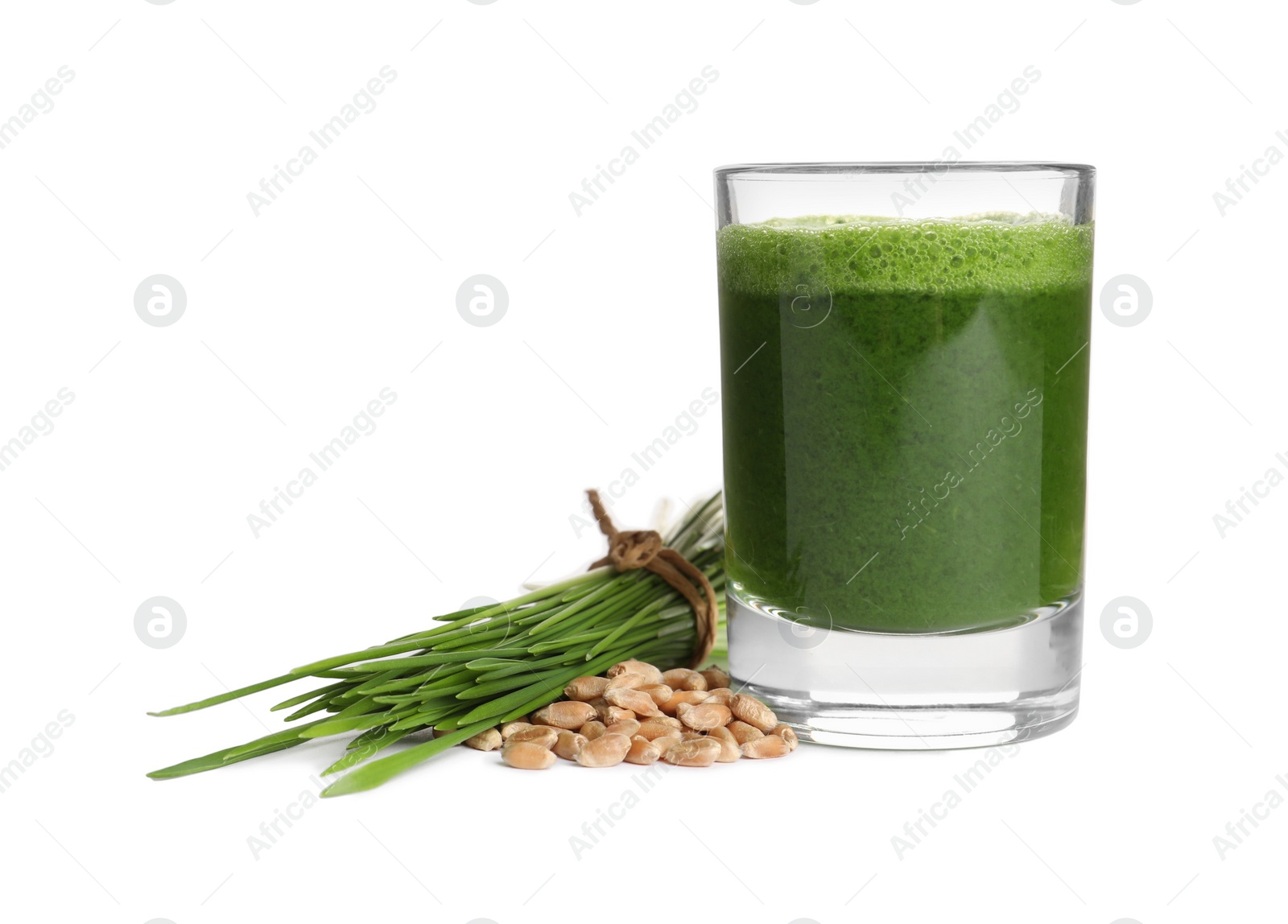 Photo of Glass of fresh wheat grass juice, seeds and sprouts on white background