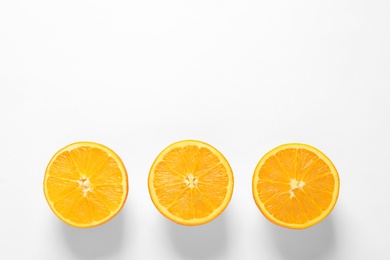 Juicy oranges on white background, top view