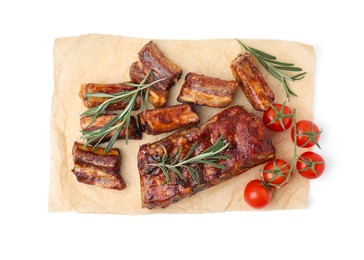 Tasty roasted pork ribs, rosemary and tomatoes isolated on white, top view