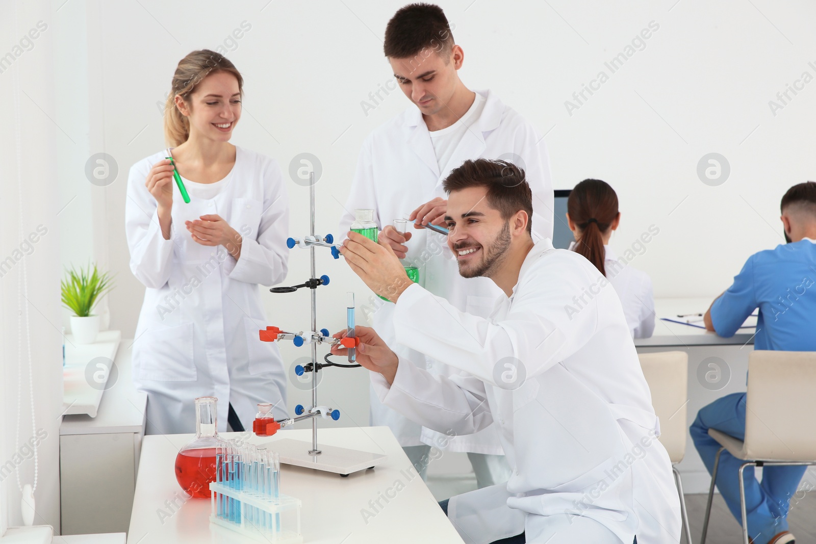 Photo of Medical students working in modern scientific laboratory