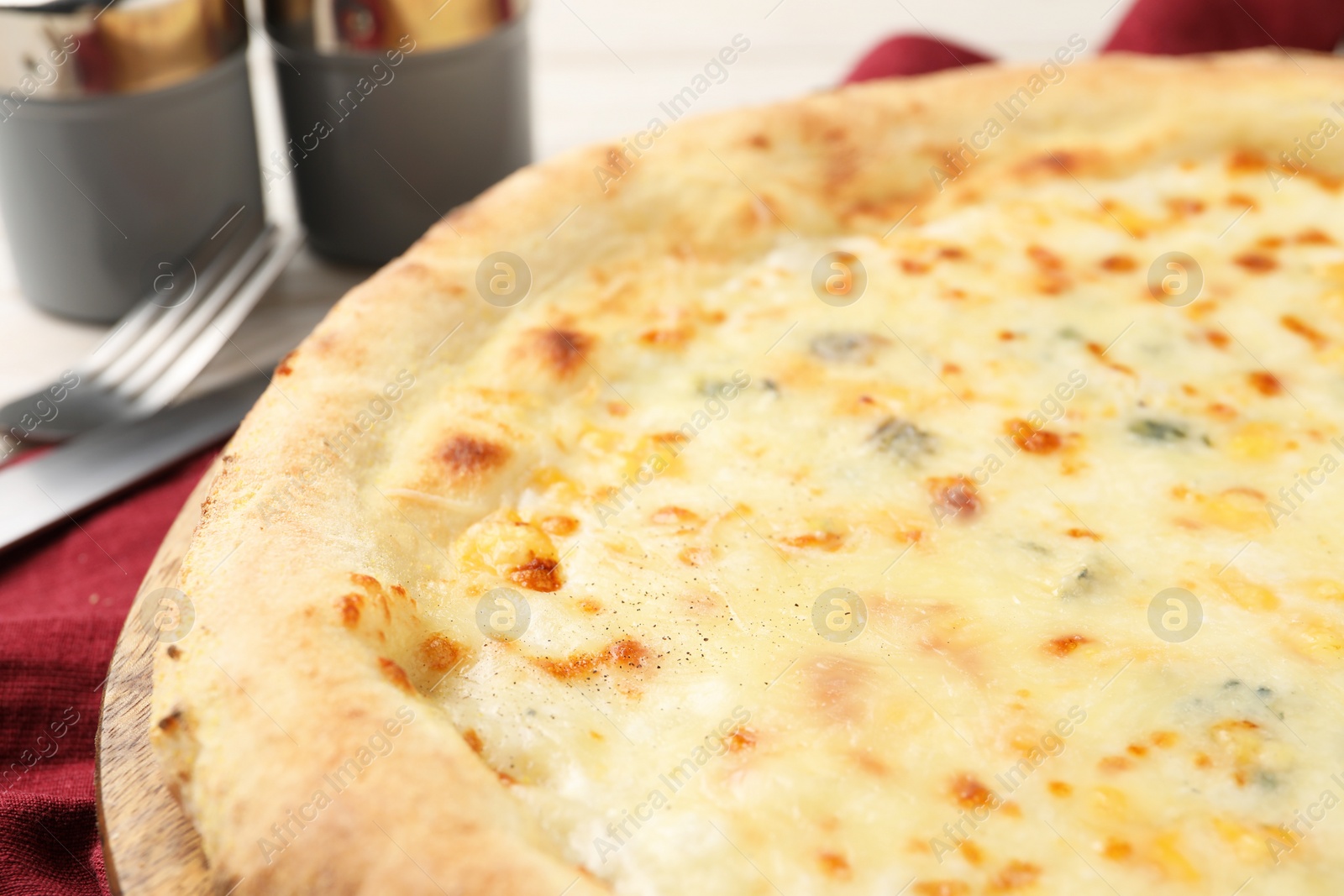 Photo of Delicious cheese pizza on table, closeup view